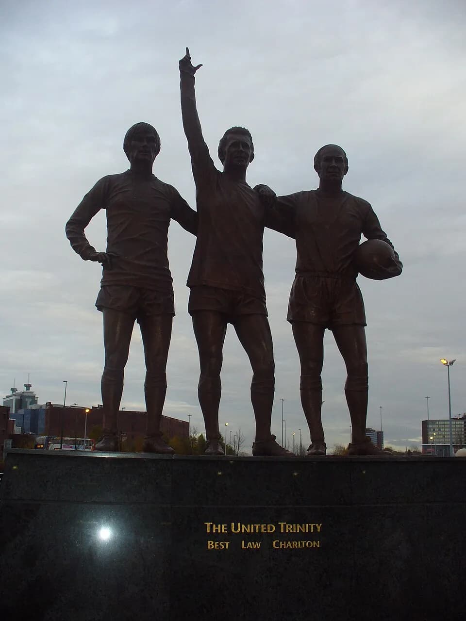 Denis Law - The United Trinity Silhouette of the statue outside Old Trafford football ground. (Best, Law & Charlton).