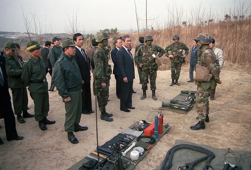Roh Tae-woo - South Korean President Roh Tae Woo, center, views a static display of vehicle equipment while visiting the soldiers of 5th Bn., 14th Inf., 25th Inf. Div. (Light), during the joint South 