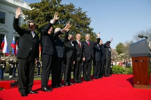 Algirdas Brazauskas - President en:George W. Bush stands with Prime Ministers of seven countries after a South Lawn ceremony welcoming them into NATO Monday, March 29, 2004. From left are: Prime Minis