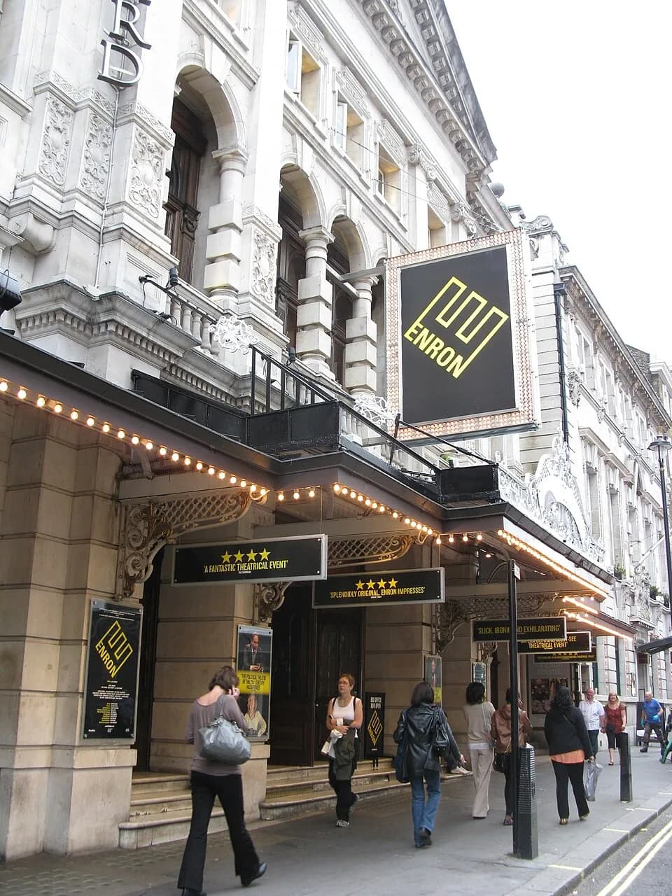 Noël Coward - A picture of the Noel Coward Theatre displaying signs for its production, Enron