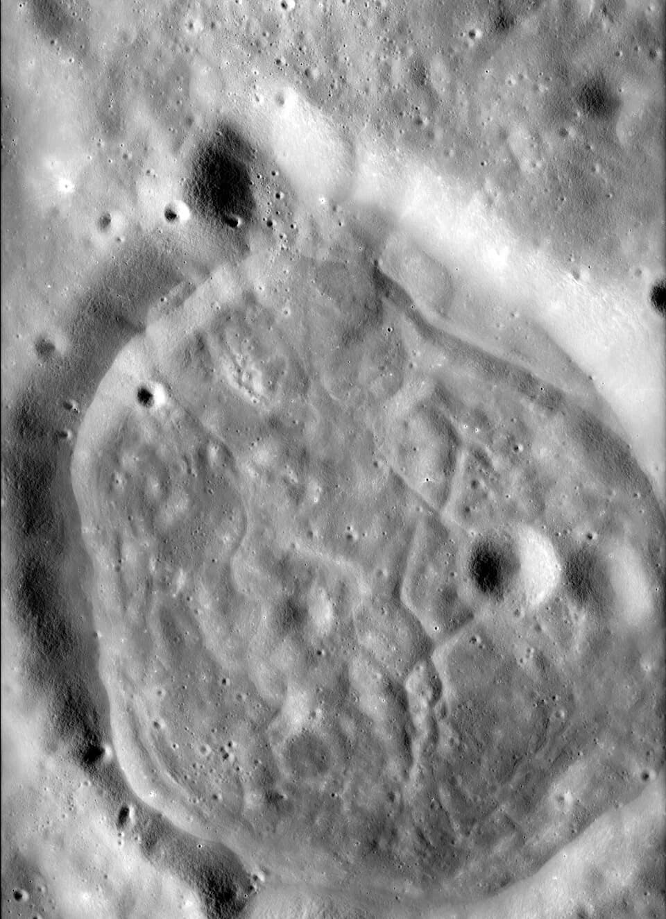 Fritz Zwicky - Apollo 17 photo of Zwicky N, an unusual crater that lies within the interior of the larger Zwicky crater. The description of the photography:
"A panoramic camera view of an unusual crat