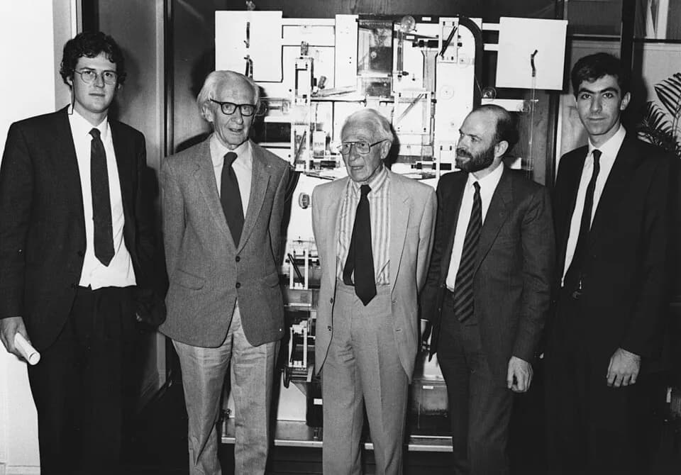 James Meade - Left to right: The team that restored the Phillips Machine, Colin Carter (a professional engineer), Professor James Meade, Professor Walter Newlyn (University of Leeds, LSE Alumnus), Dr 
