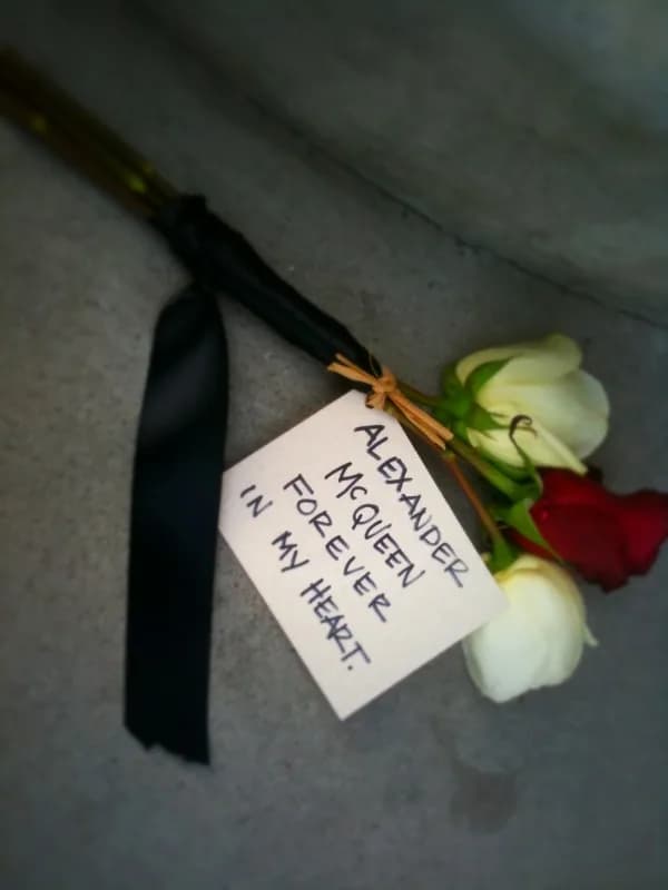 Alexander McQueen - A flower left at the Alexander McQueen flagship store upon his death.