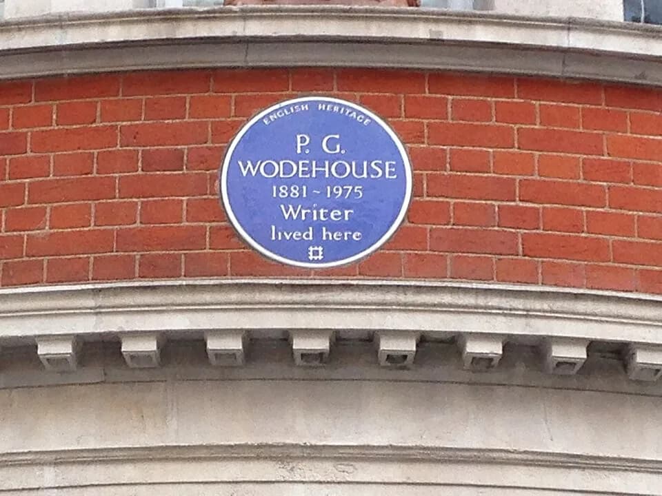 Alexander McQueen - The English Heritage blue plaque for P.G. Wodehouse at 17 Dunraven Street, Mayfair, London W1K 7EG in the City of Westminster.