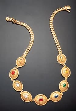 Sirikit - The Queen Sirikit Navaratna accepted by Her Majesty, the Queen of Thailand in 1993, made by Richard Shaw Brown and based on the Navaratna belief in Planetary Gemology.