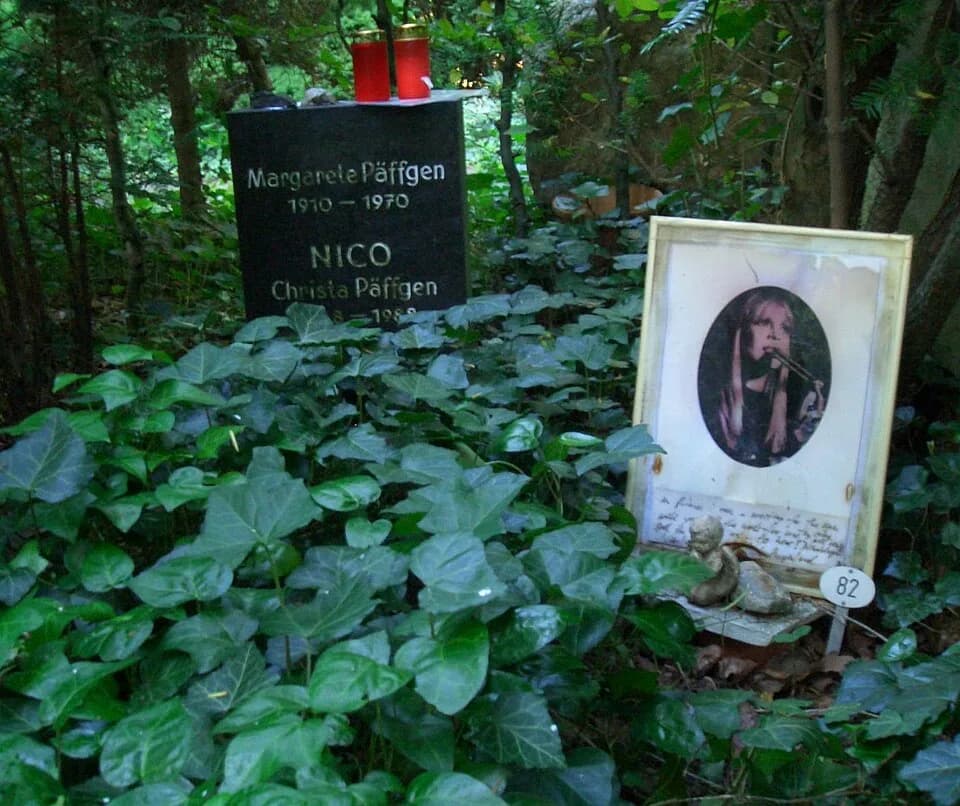Nicos - Grave of Nico (Christa Päffgen) and her mother at Friedhof Grunewald-Forst, Berlin. A fan has brought a framed photograph of her and has added some personal lines in French language for her be