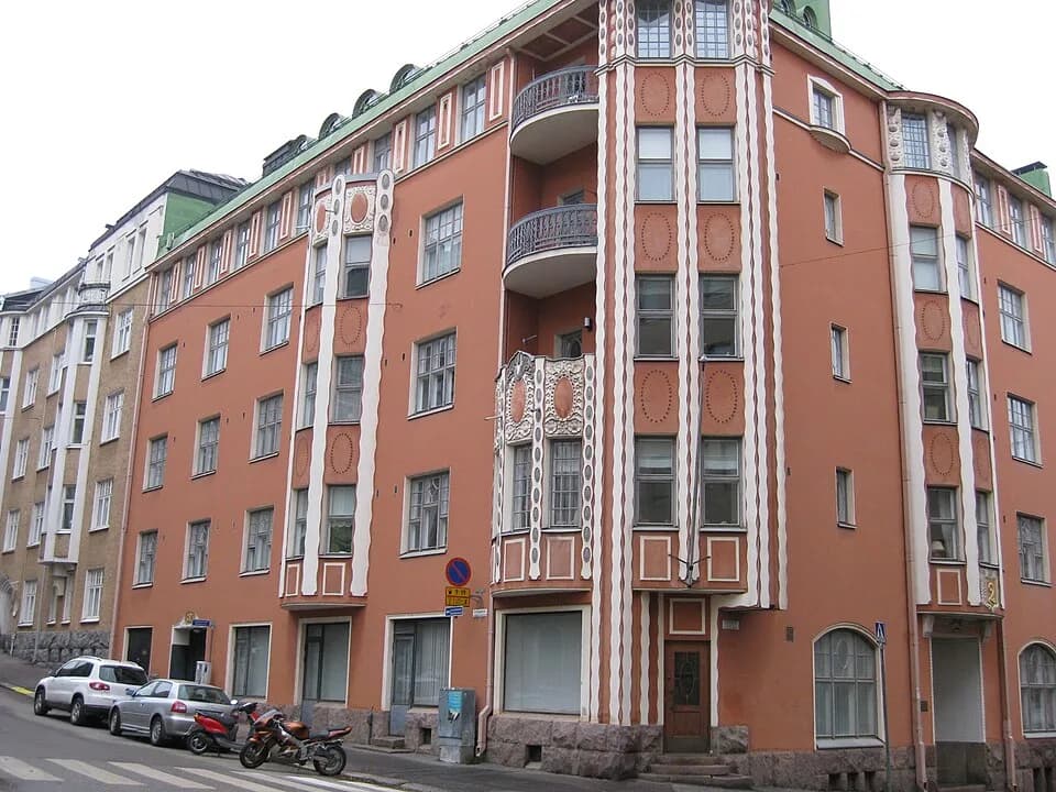 Risto Ryti - The building where Risto Ryti lived 1918 to 1935 in Helsinki. Block of flats painted pink with white details and decorations.  The number 2 is visible on the entry door to the right, and 