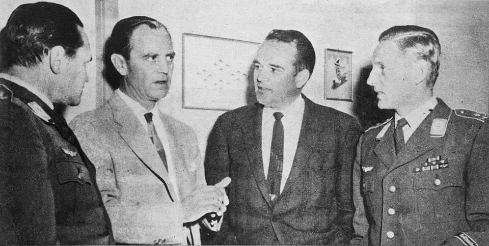 Erich Hartmann - Colonel Hubert Zemke and Captain Walker Mahurin, formerly of the 56th Fighter Group, discuss tactics with Oberst Walther Krupinski and Oberst Eric Hartmann of the German Air Force, 19