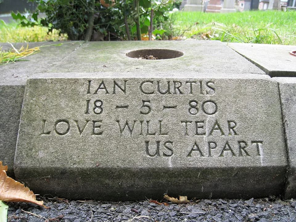 Ian Curtis - Close-up view of Ian Curtis' grave at Macclesfield cemetery, England, UK. The day after this photo was taken, the inscribed curbstone was stolen!! 

I hope the person who did this has the