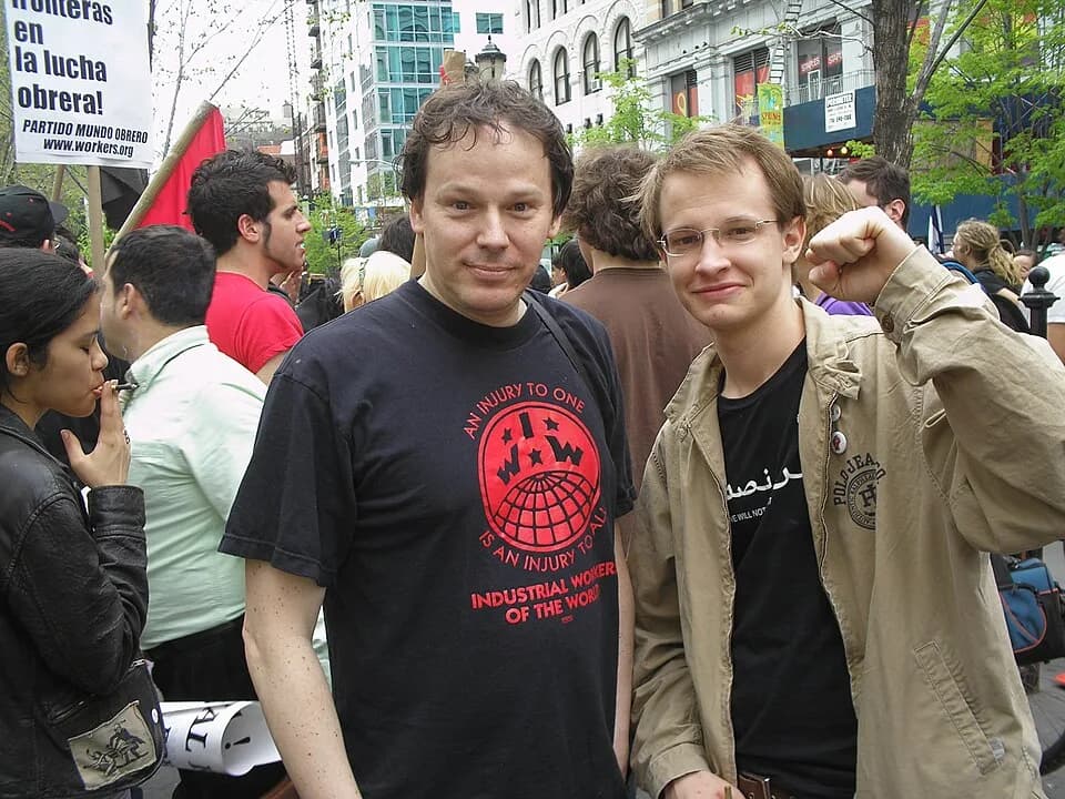 David Graeber - David Graeber (in IWW t-shirt, center) with Brian Kelly at a May Day immigrant rights rally at NYC's Union Square. This photograph has been widely reproduced by a variety of publicatio