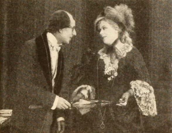 George Arliss - Still from the American historical drama film Disraeli (1921) with George Arliss and Florence Arliss, on page 61 of the November 1921 Photoplay.