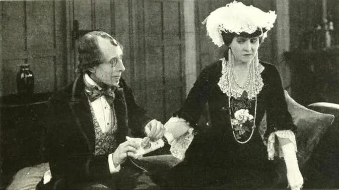 George Arliss - Still from the American film Disraeli (1921) with George Arliss and Margaret Dale, on page 107 of Peter Milne, Motion Picture Directing; The Facts and Theories of the Newest Art (1922)