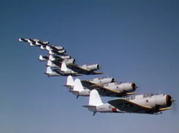 Michael Curtiz - U.S. Navy Vought SB2U Vindicator dive bombers of Bombing Squadron VB-4 High Hatters in formation during the movie Dive Bomber (1941). VB-4 operated from the USS Enterprise (CV-6) in t