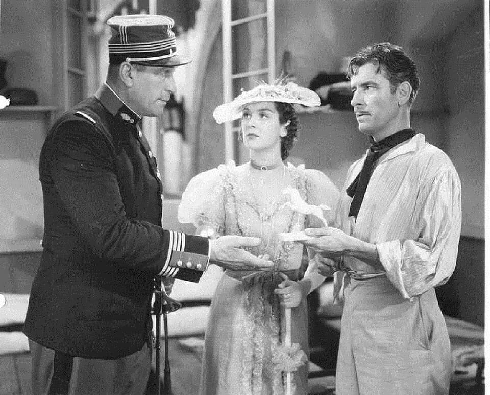 Ronald Colman - Ronald Colman, Victor McLaglen, and Rosalind Russell in Under Two Flags (1936).