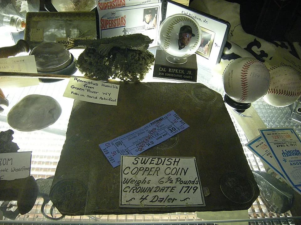 Ulrika Eleonora I of Sweden - Miscellaneous objects in the permanent collection of Ye Olde Curiosity Shop, Seattle, Washington. Among other things, a big copper "coin" from Sweden, and various basebal