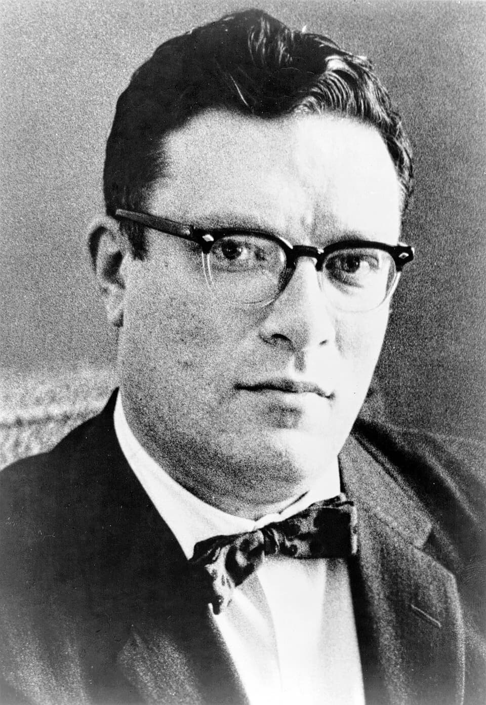 Isaac Asimov - Dr. Isaac Asimov, head-and-shoulders portrait, facing slightly right. Published in 1965, this photo also appears on the jacket of the Doubleday first edition of Nine Tomorrows so date o
