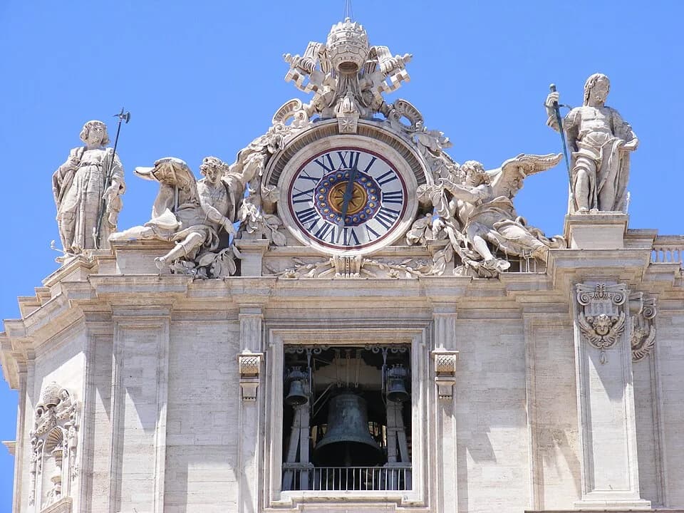 Alexander VII - The top-left corner of St. Peter's Basilica's façade, Vatican City. The standing statues are Saints Thaddeus (left) and Matthew (right).