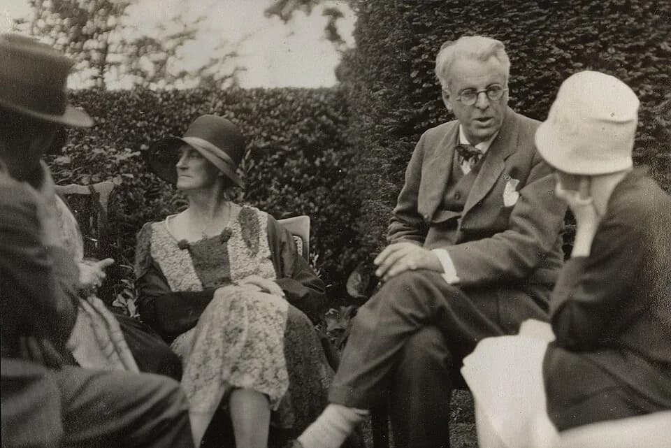 William Butler Yeats - Walter de la Mare; Bertha Georgie Yeats (née Hyde-Lees); William Butler Yeats; unknown woman, by Lady Ottoline Morrell (died 1938). See source website for additional information