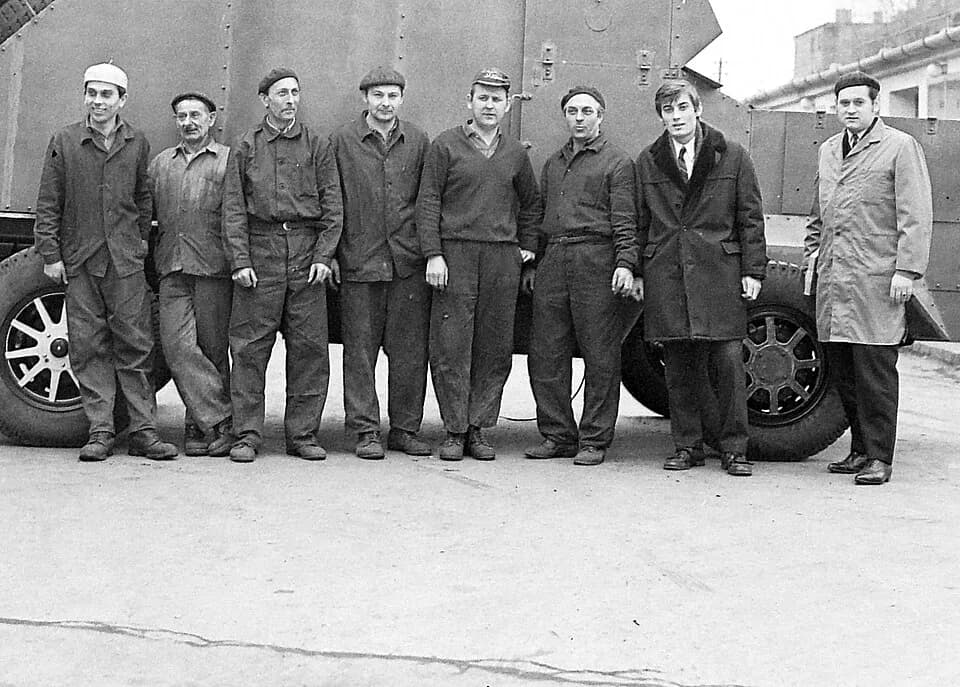 Vladimir Lenin - Portrait photographs of (Csepel Automobile?) factory's workers group. They made a replica of Vladimir Lenin's armored car (see behind the group). On the right wing two engineer-design
