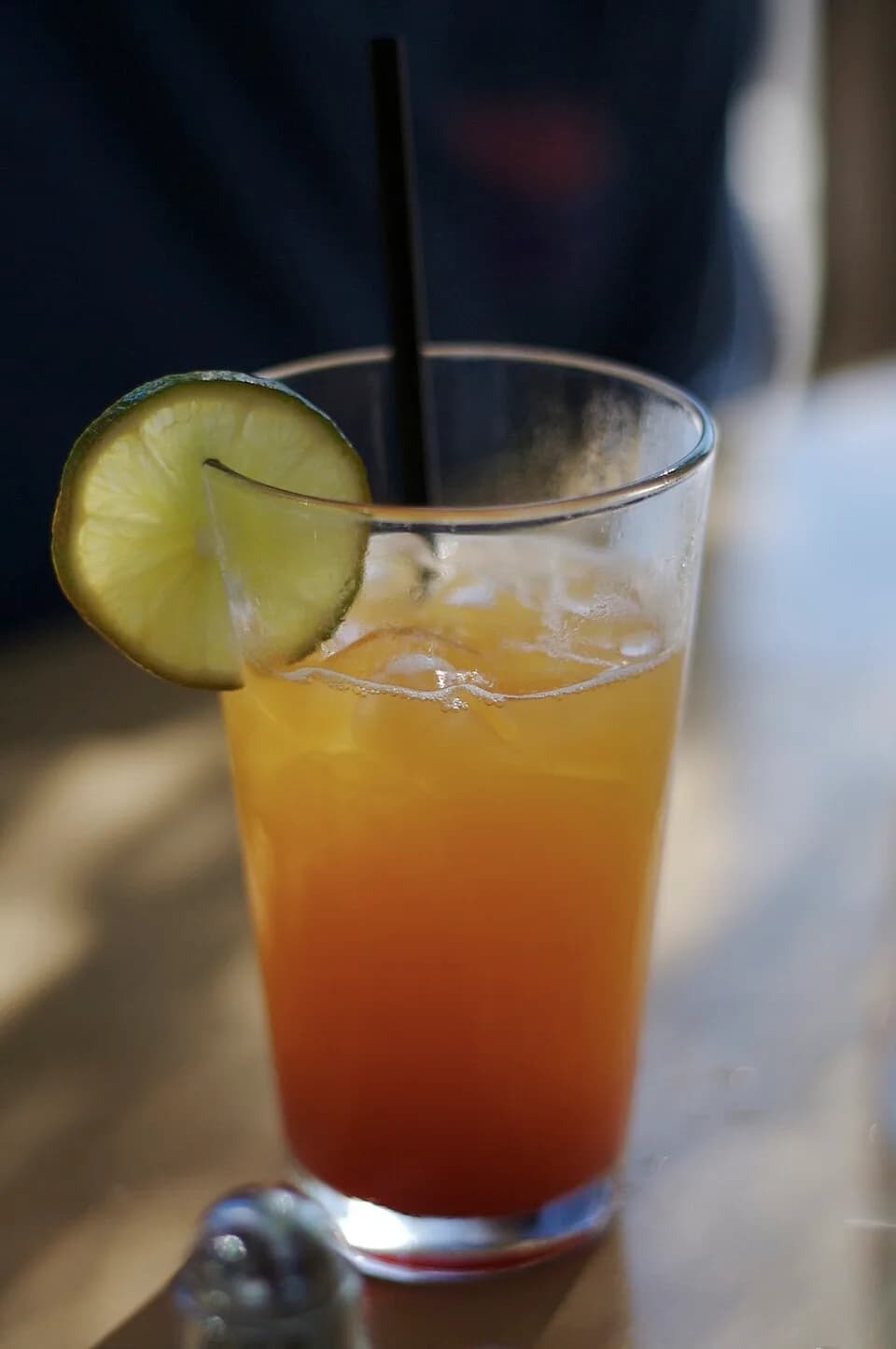 Shirley Temple - Canadia-style Shirley Temple: "Beautiful *and* delicious. Grenadine, 7-up, Orange juice, Lime, Straw" (drink, Vancouver, Shirley Temple, orange)