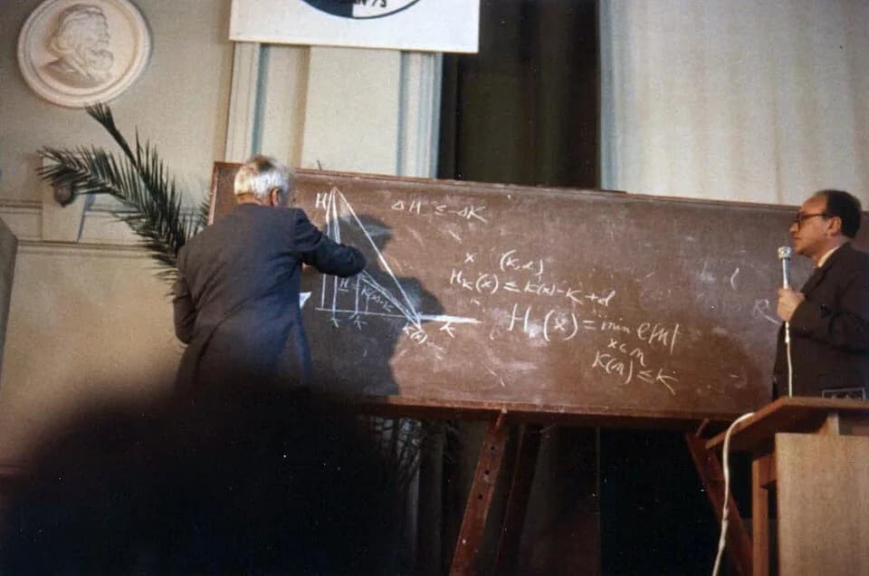 Andrey Kolmogorov - taken at the 1973 Soviet Information Theory Symposium (may not be the exact title) held in Tallinn, Estonian SSR. Kolmogorov delivers his talk. A.M. Yaglom is also on the picture.