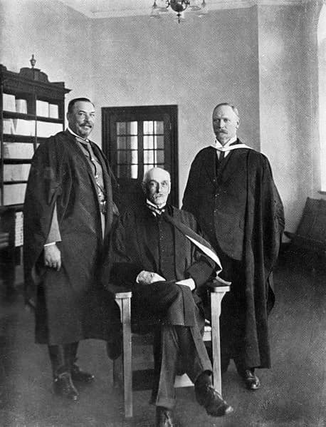 Jan Christiaan Smuts - John X. Merriman between Gen. Louis Botha (standing left) and General. Jan Smuts (standing right),  National Convention of South Africa (1909).