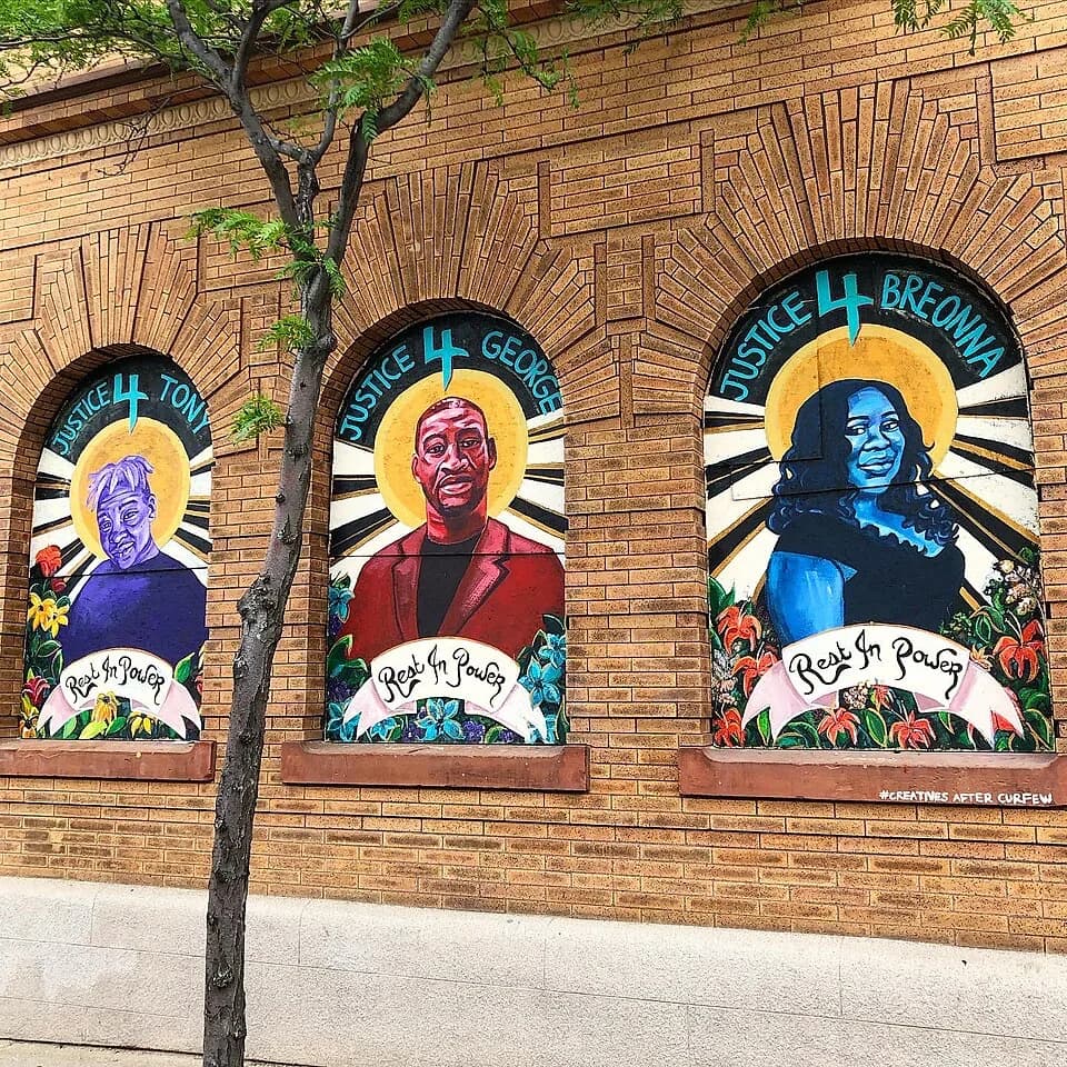 George Floyd - A mural in Minneapolis, Minnesota depicting three Black Americans who were killed by police officers in 2020: George Floyd, Tony McDade, and Breonna Taylor. This mural was painted by Le