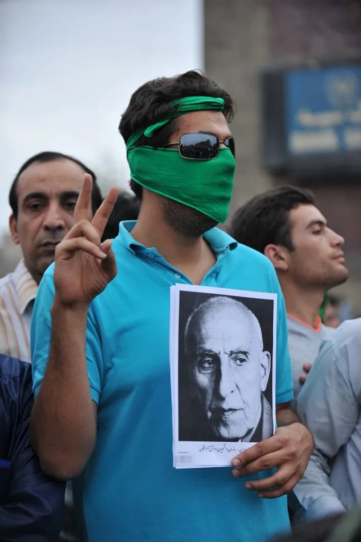 Mohammad Mosaddegh - Protester holding picture of Mosadegh during the silent demonstration in Tehran on June 17 - part of the 2009 Iranian election protests