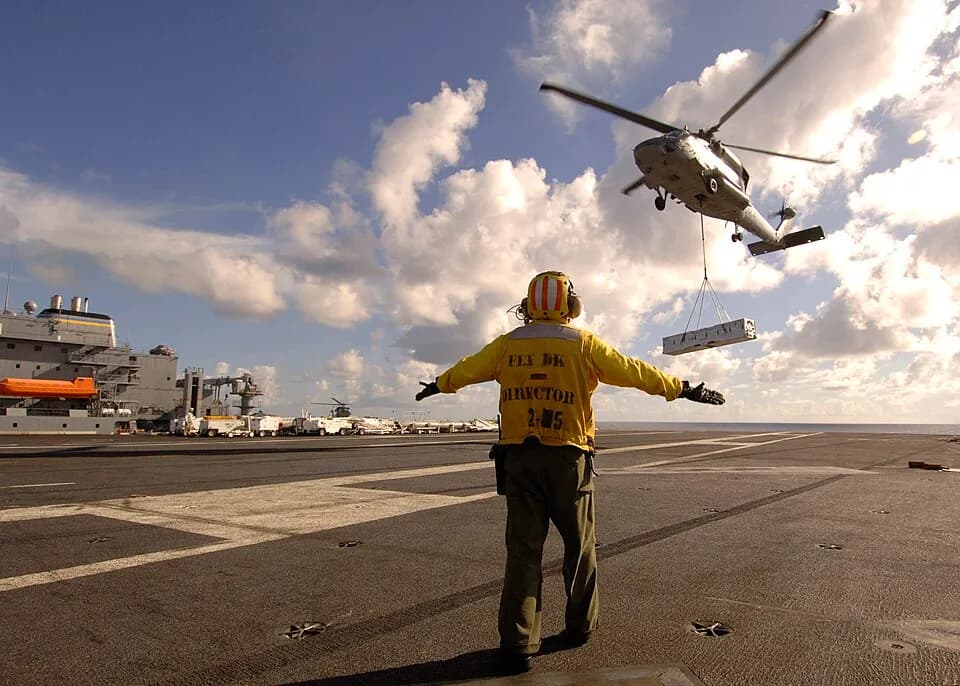Alan Shepard - PACIFIC OCEAN (Sept. 10, 2008) Aviation Boatswain's Mate (Handling) 1st Class Kenji Kimura, assigned to the aircraft carrier USS George Washington (CVN 73), directs an SH-60F Sea Hawk h