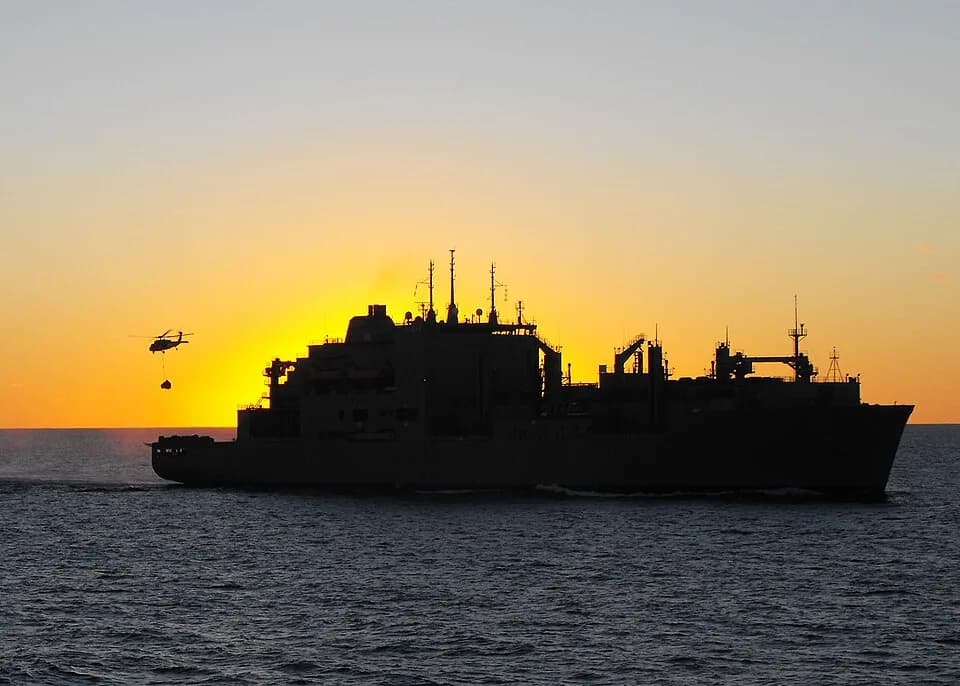 Alan Shepard - PACIFIC OCEAN (July 11, 2009) An MH-60S Sea Hawk helicopter assigned to the Island Knights of Helicopter Combat Squadron (HSC) 25, transfers stores from the Military Sealift Command dry