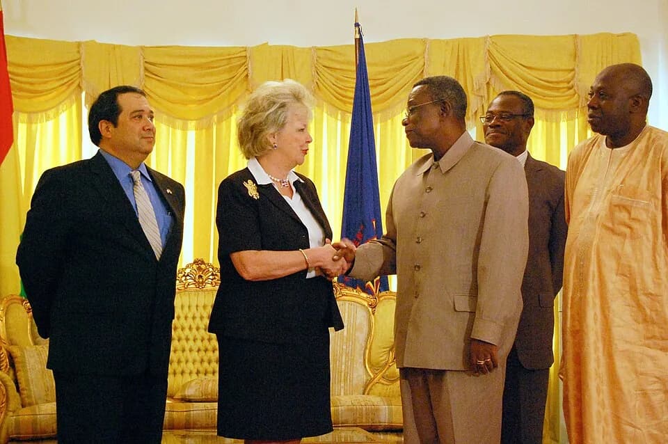 John Evans Atta Mills - Ghana's President John Evans Atta Mills shakes hands with Ambassador Mary Carlin Yates, U.S. Africa Command's deputy to the commander for civil military activities during a mee