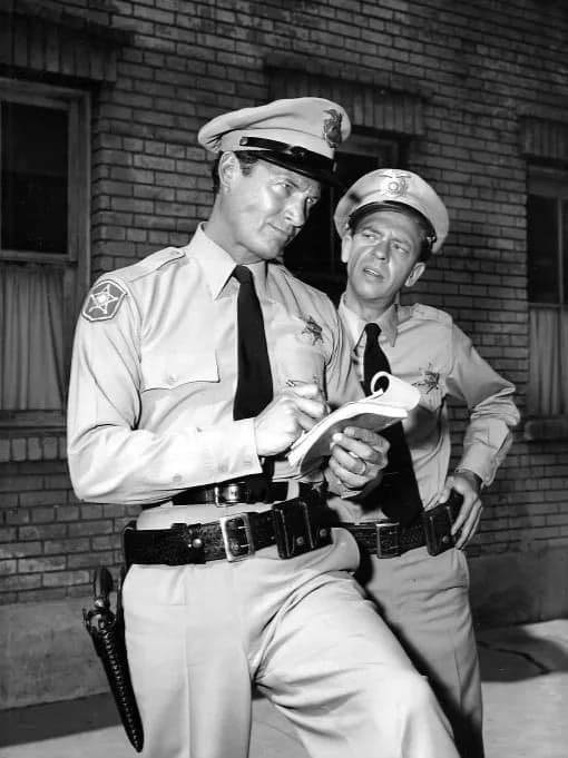 Don Knotts - Photo of Don Knotts (Barney Fife) and Mark Miller from the television program The Andy Griffith Show.  In this episode, Miller plays a law officer who is sent to Mayberry for training; Ba
