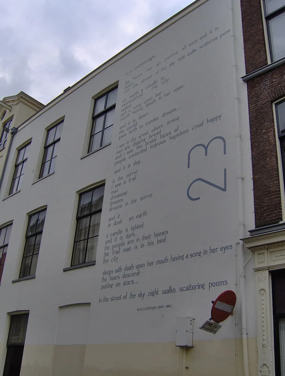 E. E. Cummings - The poem The hours rise of the American poet Edward Estlin Cummings on a wall of the building at the Nieuwe Rijn 36 in Leiden, The Netherlands