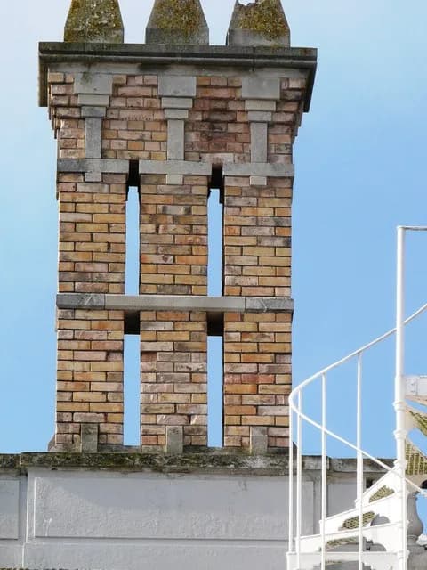 Isaac Singer - Brick chimney stack, Oldway Mansion, Paignton Chimney and fire escape on the Oldway Mansion roof.