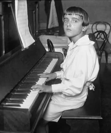 Nino Rota - Italian composer Nino Rota (1911-1979) as a young boy at the piano in 1923.