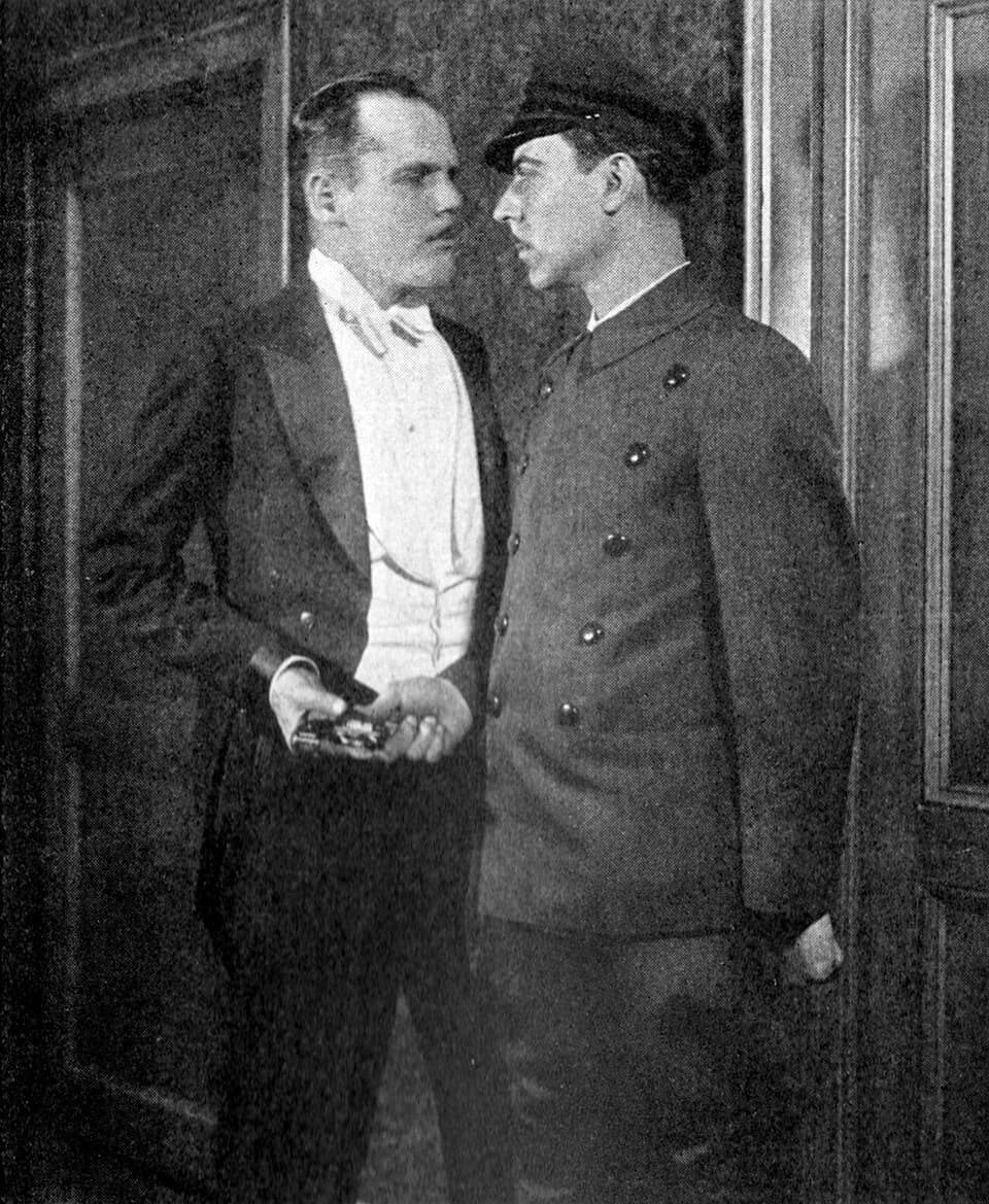 Vicki Baum - Promotional photograph of Henry Hull and Joseph Calleia in the original Broadway stage production of Grand Hotel
Caption reads as follows:The thieves whom the baron serves take no chances