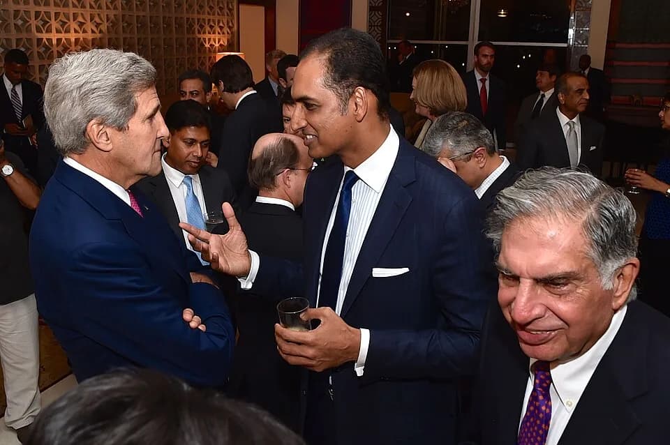 Ratan Tata - U.S. Secretary of State John Kerry chats with G.V. Sanjay Reddy, Vice Chairman of GVK Power and Infrastructure Limited, before a working dinner on July 30, 2014, with Indian and American 