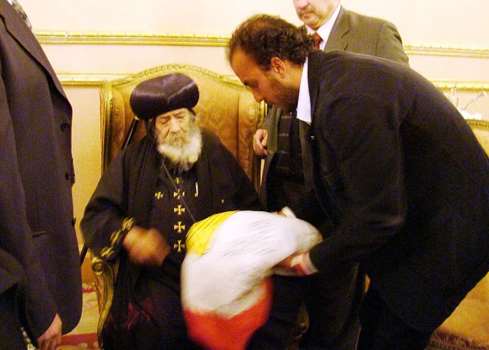 Pope Shenouda III of Alexandria - The Egyptian traveller and adventurer Ahmed w:Haggagovic and the Pope w:Pope Shenouda III of Alexandria