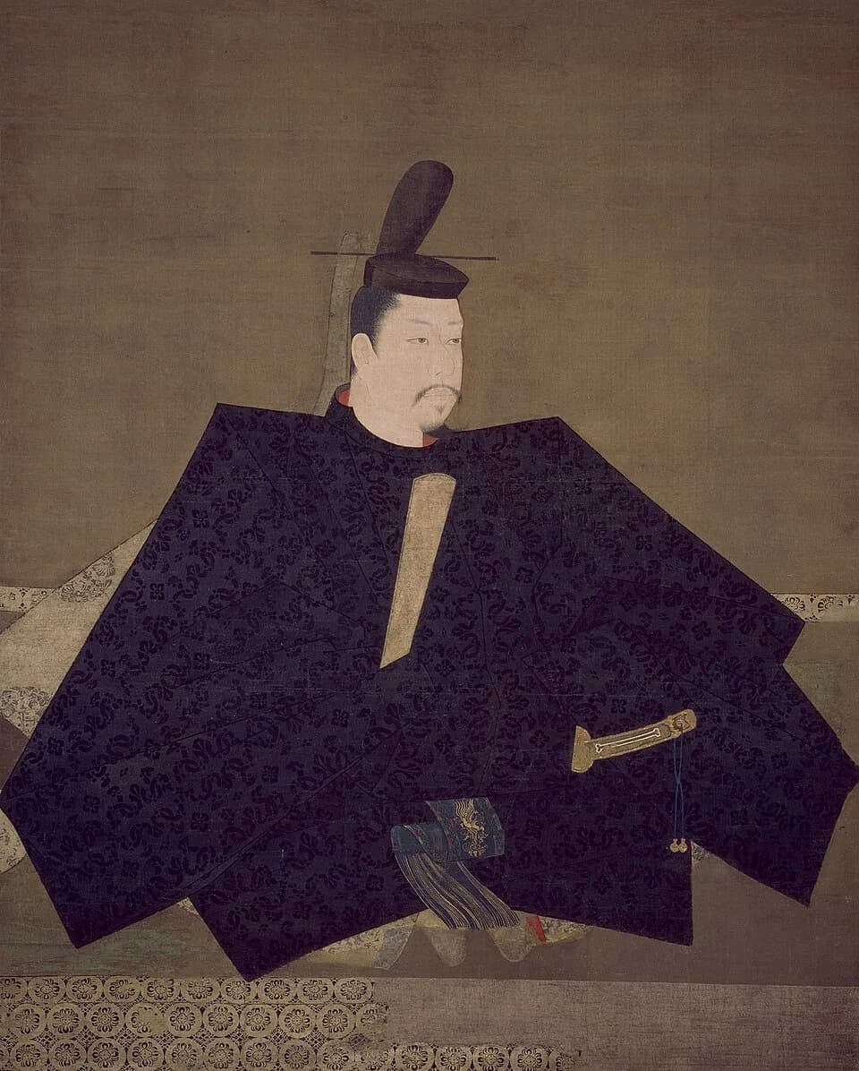 Minamoto no Yoritomo - Portrait of Yoritomo, Hanging scroll; color on silk. Owned by Jingo-ji temple in Kyoto. Formerly identified as the original portrait by Fujiwara  Takanobu who according to the J
