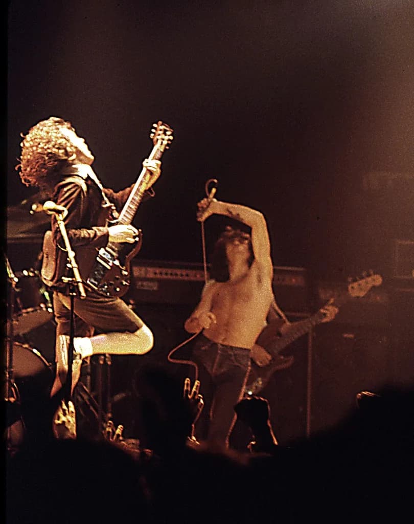 Bon Scott - AC/DC at the Ulster Hall, Belfast. Angus Young (left) and Bon Scott (right).