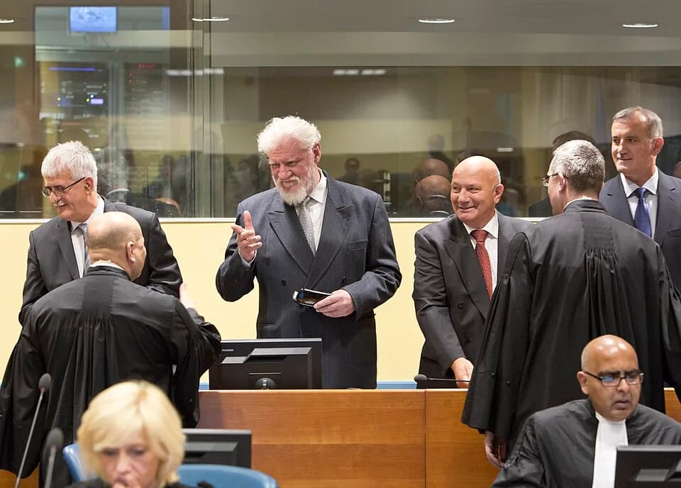 Slobodan Praljak - Bruno Stojić, Slobodan Praljak, Milivoj Petković, and Valentin Ćorić at the Prlić Trial Judgement in 2013