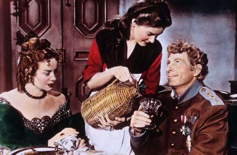 Elsa Lanchester - Left to Right: Elsa Lanchester, Barbara Bates, and Danny Kaye in The Inspector General (1949) - cropped screenshot
