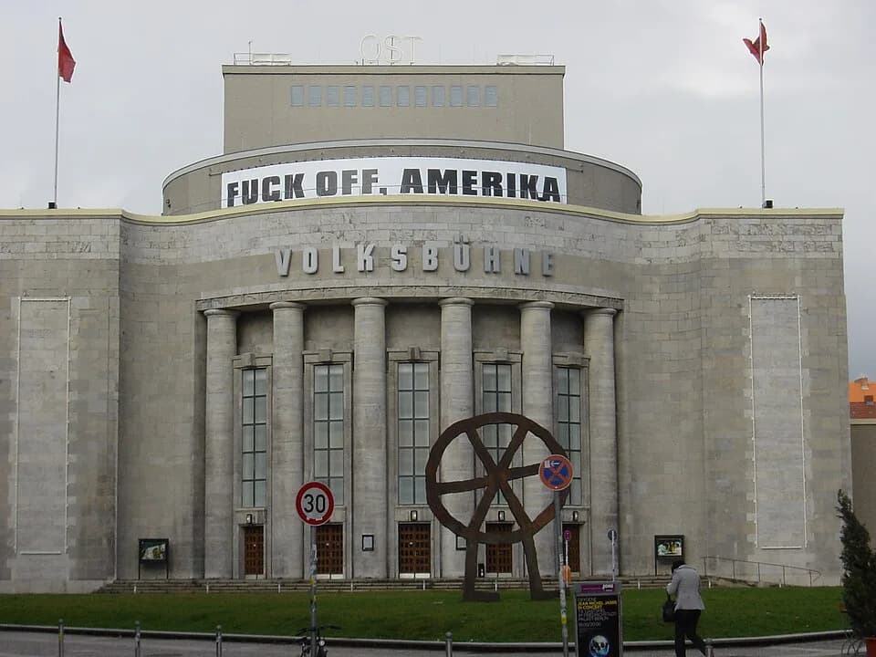 Eduard Limonov - Volksbuehne - March 2008, with a banner advertising a staging of Eduard Limonov's Fuck off, Amerika
