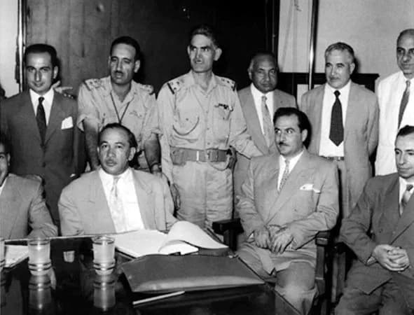 Abdul Salam Arif - Leaders of the July 14, 1958 revolution in Iraq, including Khaled al-Naqshabendi (front row, left), Abd as-Salam Arif (back row, second from left), Abd al-Karim Qasim (back row, thi