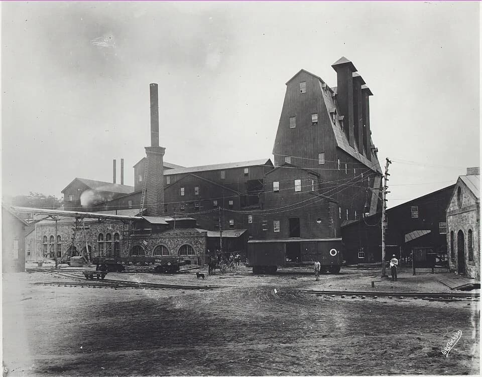 Thomas Edison - Tower containing magnetic ore separators at Ogden mine. Stone building is power house or boiler house. Corliss engine in frame building- extreme left, 1895.