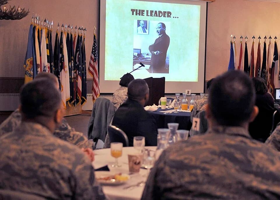 Martin Luther King Jr. - Airmen watch a video presented by the African American Heritage Committee during the Martin Luther King Jr. breakfast at the Yukon Club Jan. 29, 2013, Eielson Air Force Base,