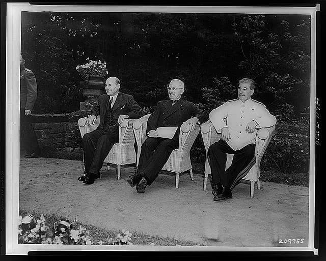 Harry S. Truman - Clement Attlee, Harry Truman, and Joseph Stalin, seated outdoors at Berlin conference