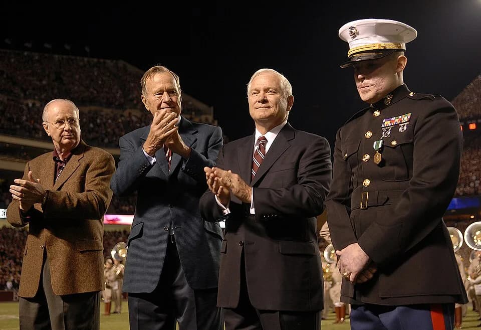 George H. W. Bush - Interim President of Texas A&amp;M University Dr. Eddie J. Davis (left), former President George H. W. Bush (2nd from left) and Secretary of Defense Robert M. Gates (center) applau
