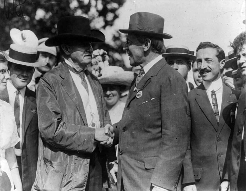Woodrow Wilson - U.S. Senator Benjamin Tillman (left, black hat) shaking hands with New Jersey Governor Woodrow Wilson