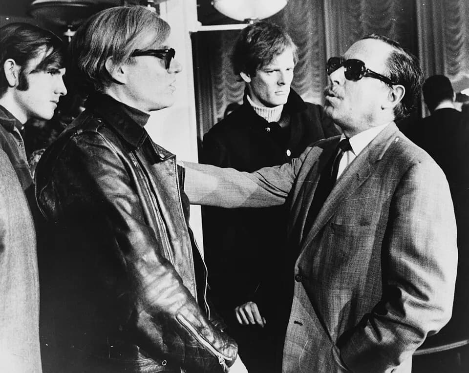 Andy Warhol - Andy Warhol (left) and Tennessee Williams (right) talking on the SS France, in the background: Paul Morrissey.